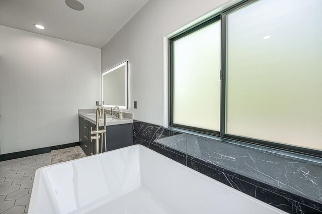 1292 E Valley Forge Dr, Fresno, CA 93720 - bathroom featuring a bathtub, double vanity, and recessed lighting