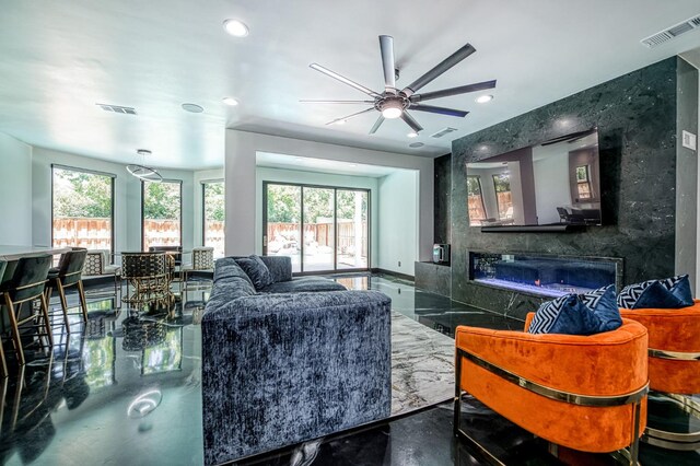 1292 E Valley Forge Dr, Fresno, CA 93720 - living area with plenty of natural light, a ceiling fan, recessed lighting, and a glass covered fireplace