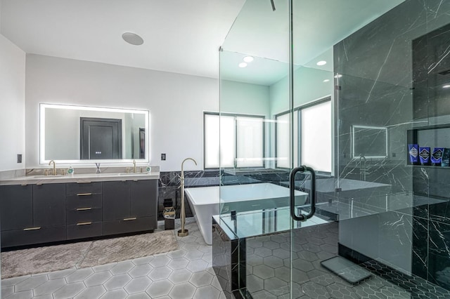 1292 E Valley Forge Dr, Fresno, CA 93720 - full bath with tile patterned flooring, a soaking tub, double vanity, a stall shower, and recessed lighting