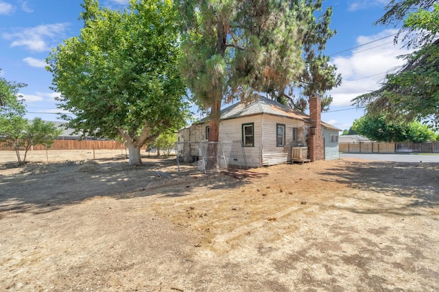760 Sunnyside Ave, Clovis, CA 93611 - rear view of property with a chimney and crawl space