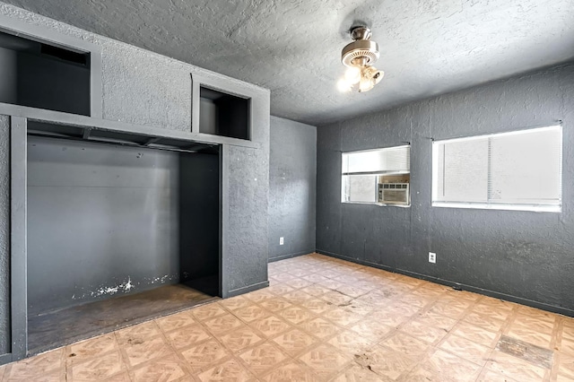 760 Sunnyside Ave, Clovis, CA 93611 - unfurnished bedroom featuring a textured wall, a textured ceiling, and cooling unit
