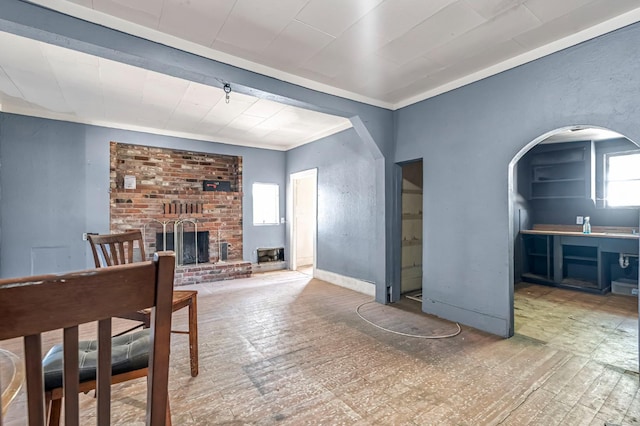 760 Sunnyside Ave, Clovis, CA 93611 - living area with a fireplace, arched walkways, and crown molding