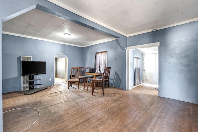 760 Sunnyside Ave, Clovis, CA 93611 - dining area featuring arched walkways, wood-type flooring, and crown molding