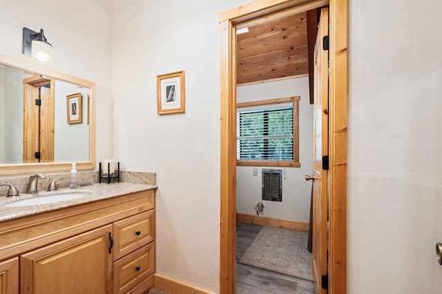 42215 Rock Ledge Rd, Shaver Lake, CA 96161 - bathroom featuring vanity, wood finished floors, and heating unit