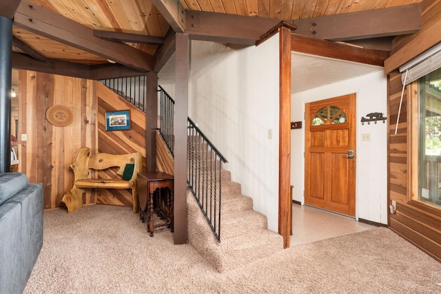 42215 Rock Ledge Rd, Shaver Lake, CA 96161 - stairs featuring wooden walls, a wood ceiling with exposed beams, and carpet