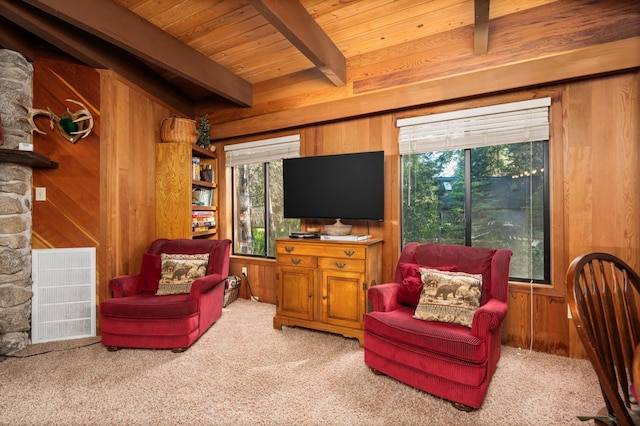 42215 Rock Ledge Rd, Shaver Lake, CA 96161 - living area with wood walls, carpet, healthy amount of natural light, and a wood ceiling with exposed beams