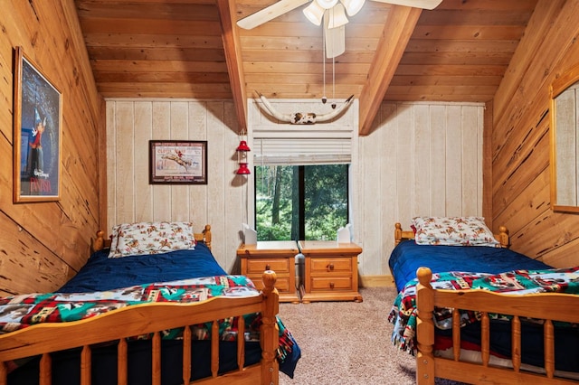 42215 Rock Ledge Rd, Shaver Lake, CA 96161 - carpeted bedroom featuring wooden walls, a wooden ceiling with exposed beams, and ceiling fan