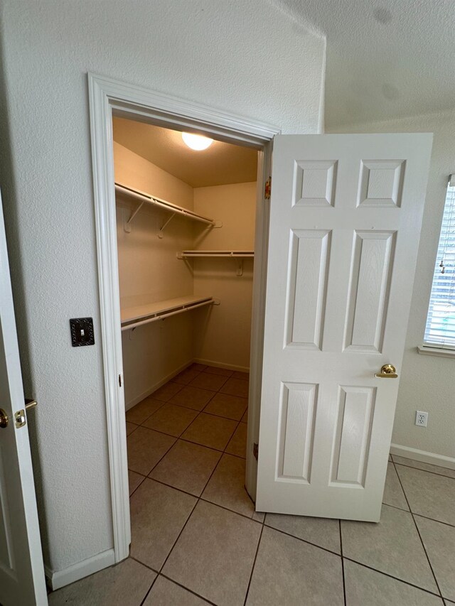 220 S Double Tree Way, Madera, CA 93637 - walk in closet with light tile patterned floors