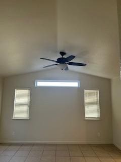 220 S Double Tree Way, Madera, CA 93637 - unfurnished room with lofted ceiling, light tile patterned flooring, and ceiling fan