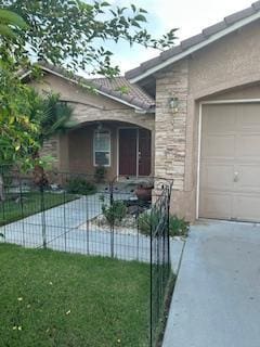 220 S Double Tree Way, Madera, CA 93637 - doorway to property with a garage and driveway