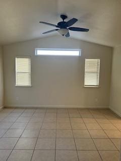 220 S Double Tree Way, Madera, CA 93637 - empty room featuring light tile patterned floors, vaulted ceiling, and a ceiling fan