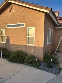 220 S Double Tree Way, Madera, CA 93637 - view of side of home with stucco siding and a patio