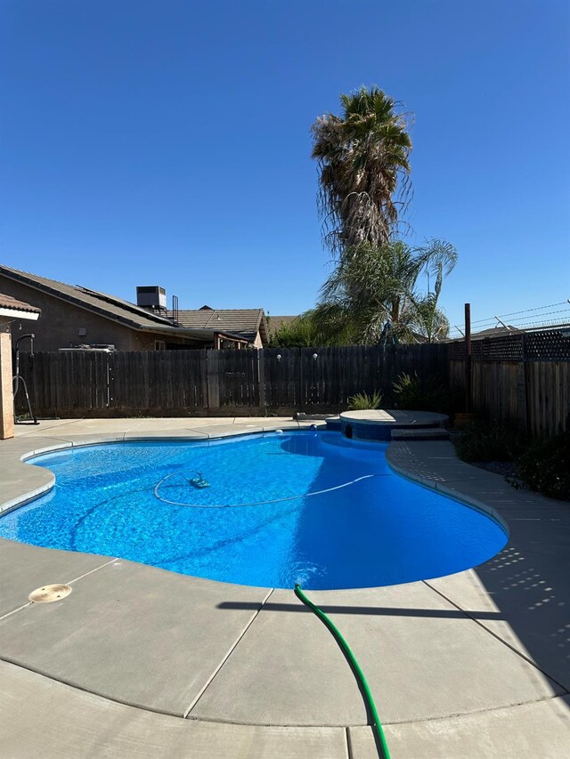 220 S Double Tree Way, Madera, CA 93637 - view of pool featuring a fenced backyard, a patio, and a hot tub
