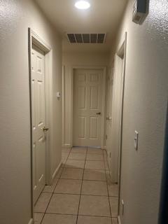 220 S Double Tree Way, Madera, CA 93637 - corridor with light tile patterned floors and baseboards