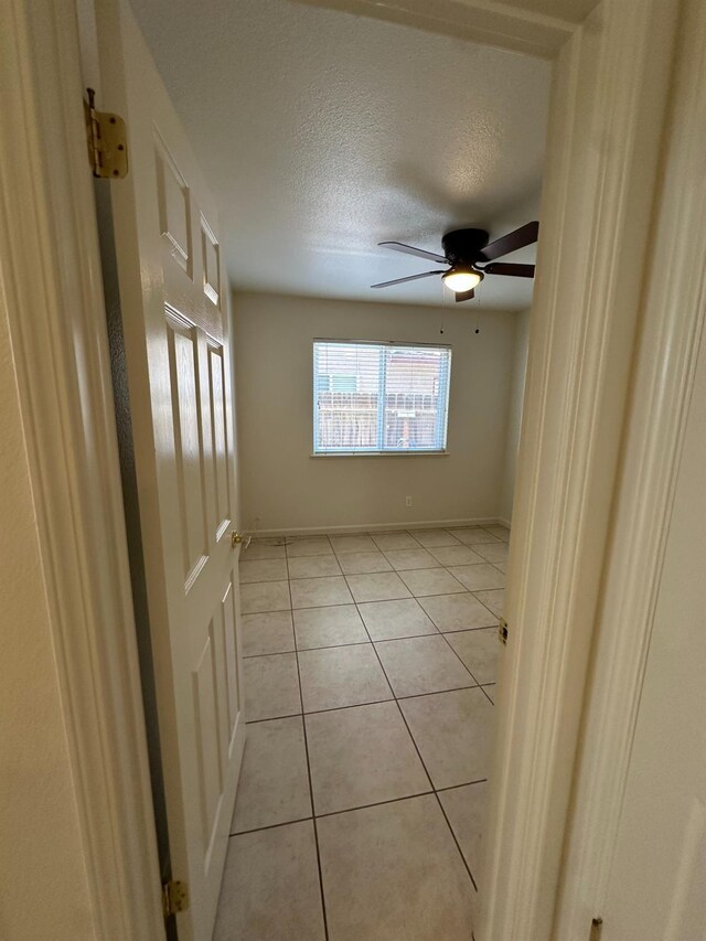 220 S Double Tree Way, Madera, CA 93637 - spare room featuring ceiling fan, light tile patterned flooring, and a textured ceiling