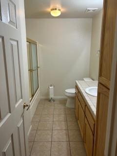220 S Double Tree Way, Madera, CA 93637 - bathroom with vanity, tile patterned flooring, and bath / shower combo with glass door