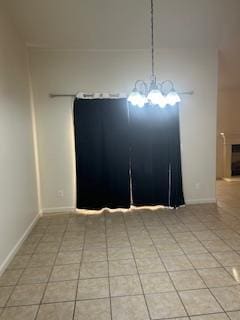 220 S Double Tree Way, Madera, CA 93637 - unfurnished dining area with light tile patterned floors and a chandelier