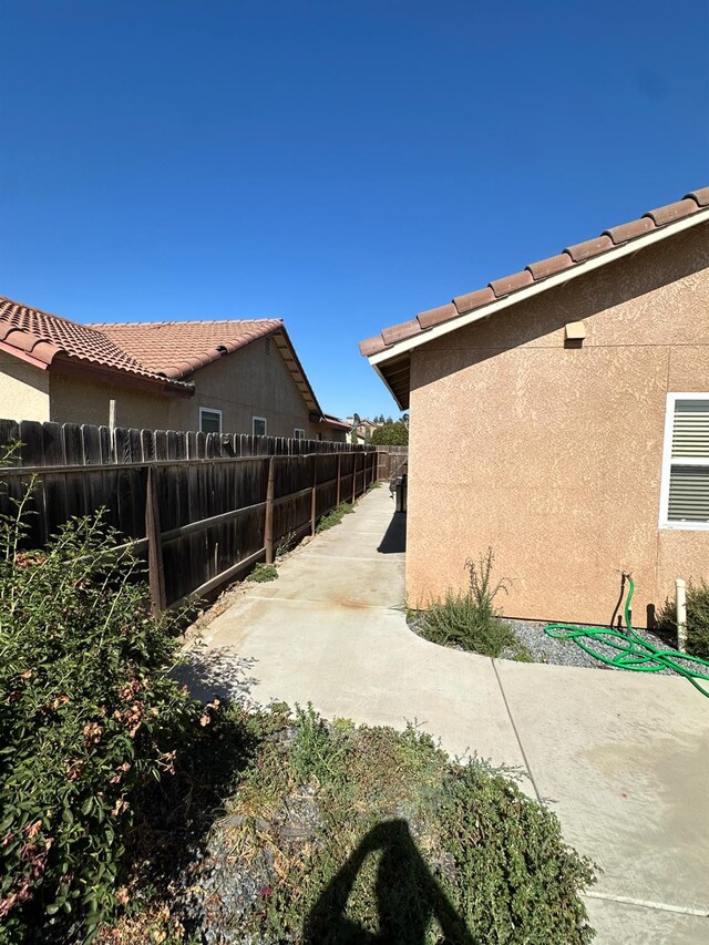 220 S Double Tree Way, Madera, CA 93637 - fenced backyard featuring a patio area