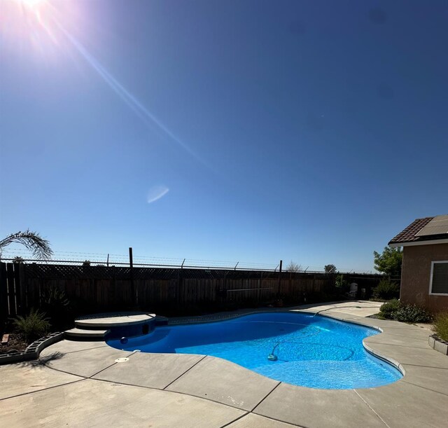 220 S Double Tree Way, Madera, CA 93637 - view of swimming pool featuring a fenced backyard, a patio, and a hot tub