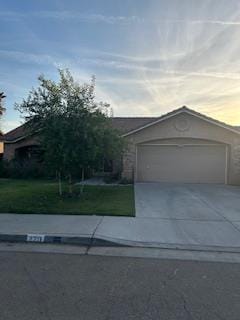 220 S Double Tree Way, Madera, CA 93637 - view of front facade featuring concrete driveway and an attached garage