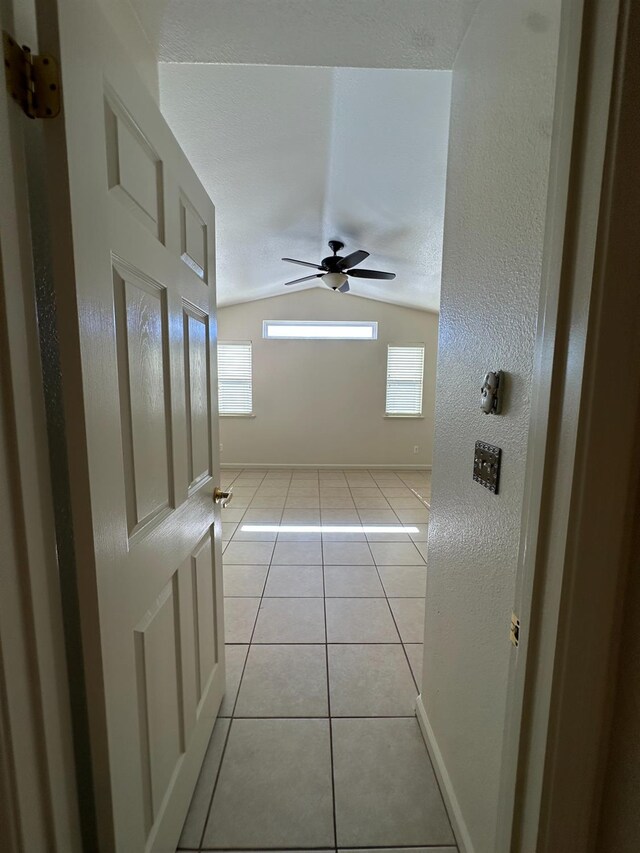 220 S Double Tree Way, Madera, CA 93637 - hallway with lofted ceiling and light tile patterned flooring