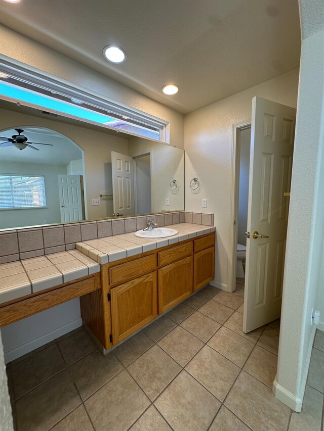 220 S Double Tree Way, Madera, CA 93637 - bathroom featuring vanity, ceiling fan, tile patterned floors, and recessed lighting