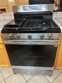 220 S Double Tree Way, Madera, CA 93637 - detailed view of stainless steel range with gas stovetop and light countertops