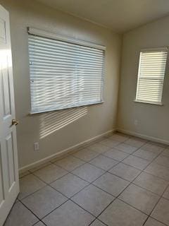 220 S Double Tree Way, Madera, CA 93637 - spare room with light tile patterned floors and baseboards
