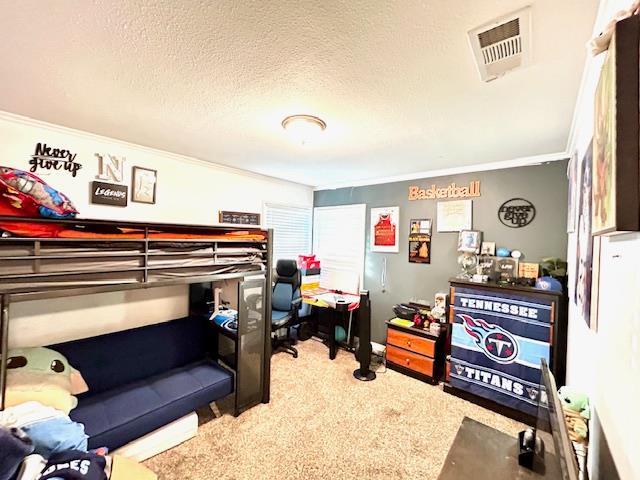 1445 E Cornell Ave, Fresno, CA 93704 - carpeted bedroom with ornamental molding and a textured ceiling