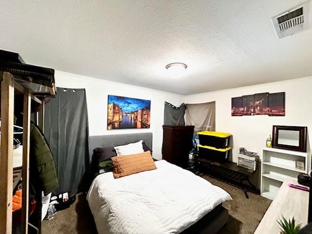 1445 E Cornell Ave, Fresno, CA 93704 - carpeted bedroom featuring a textured ceiling