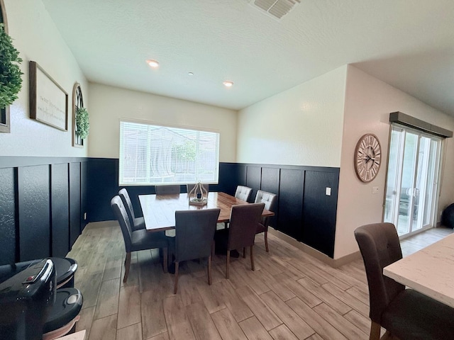 825 Spring St W, Madera, CA 93636 - dining space with a wainscoted wall, light wood finished floors, and recessed lighting