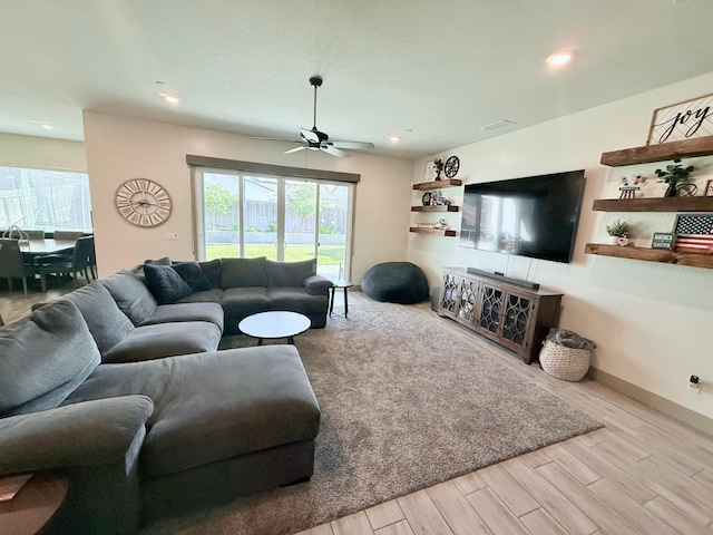 825 Spring St W, Madera, CA 93636 - living room with wood finished floors, ceiling fan, and recessed lighting