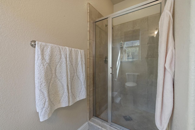 11337 N Cherry Sage Ave, Fresno, CA 93730 - bathroom featuring a stall shower and a textured wall