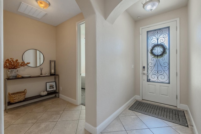 11337 N Cherry Sage Ave, Fresno, CA 93730 - foyer entrance featuring light tile patterned flooring and arched walkways