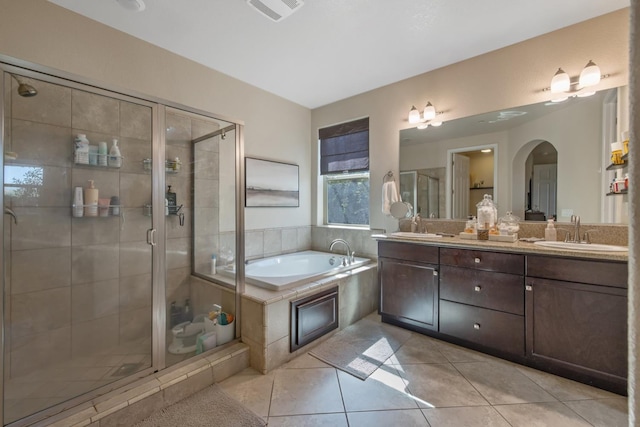 11337 N Cherry Sage Ave, Fresno, CA 93730 - full bathroom with double vanity, a bath, tile patterned flooring, and a shower stall