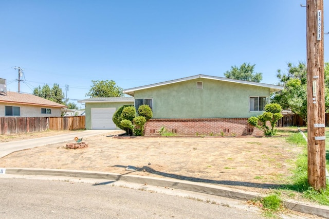 2120 Richard Ave, Sanger, CA 93657 - ranch-style house featuring stucco siding, concrete driveway, and brick siding