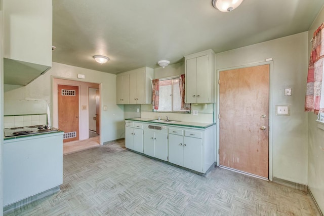 2120 Richard Ave, Sanger, CA 93657 - kitchen featuring light countertops, white cabinetry, white electric cooktop, and decorative backsplash