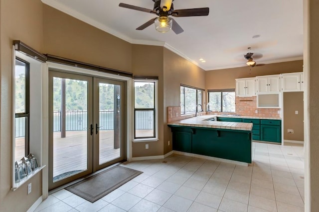 27415 Sky Harbour Rd, Friant, CA 93626 - kitchen featuring a peninsula, a ceiling fan, light tile patterned floors, and crown molding