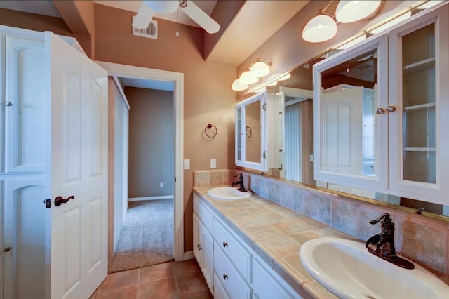 27415 Sky Harbour Rd, Friant, CA 93626 - bathroom with double vanity, a ceiling fan, tile patterned flooring, and backsplash