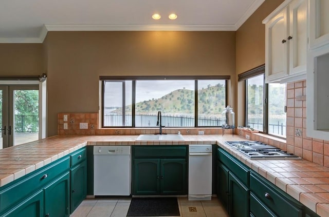 27415 Sky Harbour Rd, Friant, CA 93626 - kitchen featuring dishwasher, green cabinets, backsplash, gas stovetop, and ornamental molding