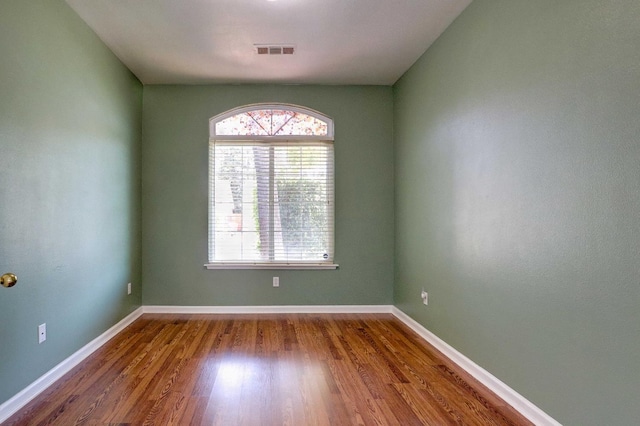 5684 W Holland Ave, Fresno, CA 93722 - empty room with plenty of natural light and wood finished floors