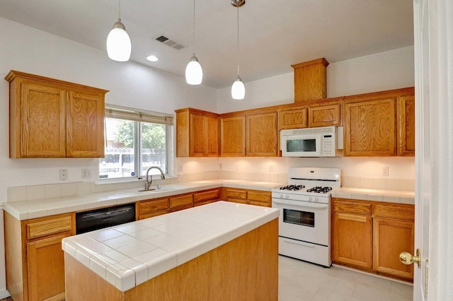 5684 W Holland Ave, Fresno, CA 93722 - kitchen with white appliances, a kitchen island, decorative light fixtures, and brown cabinetry