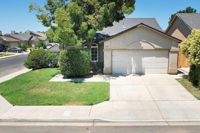 5684 W Holland Ave, Fresno, CA 93722 - view of front of property featuring a garage, stucco siding, a front yard, and driveway