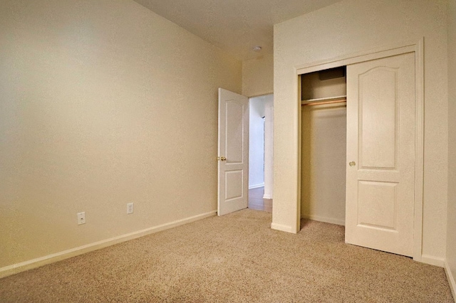 5684 W Holland Ave, Fresno, CA 93722 - unfurnished bedroom featuring light colored carpet and a closet