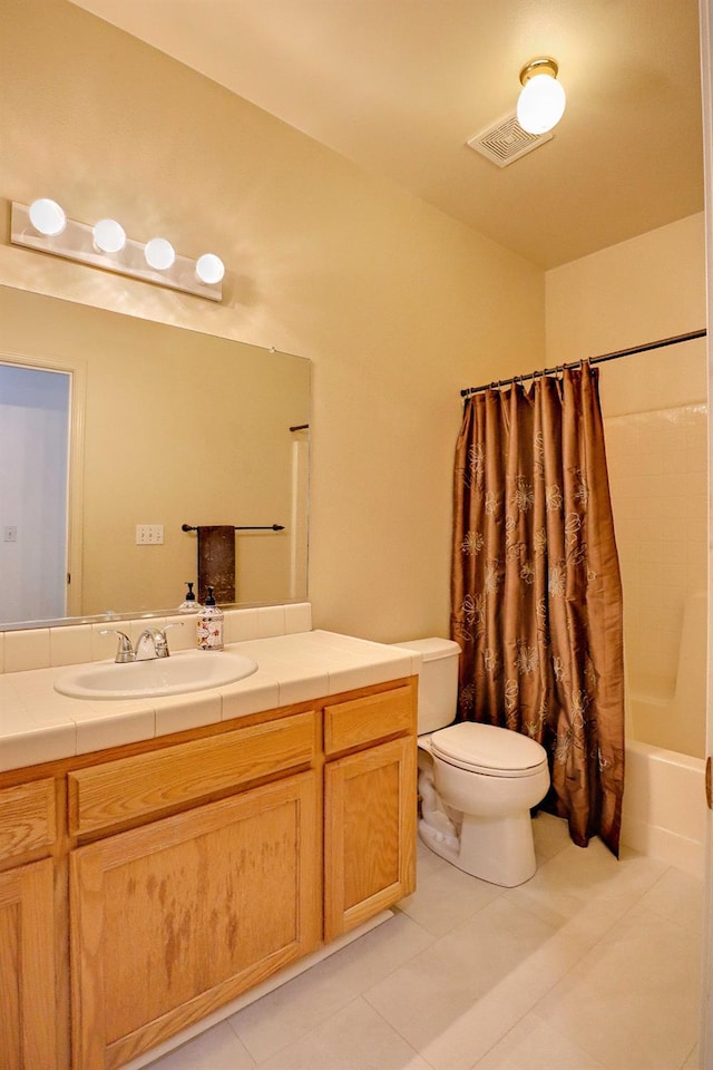 5684 W Holland Ave, Fresno, CA 93722 - full bath featuring vanity, tile patterned floors, and shower / bathtub combination with curtain