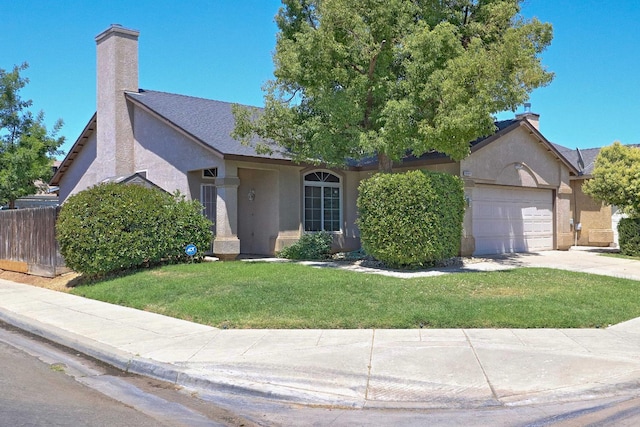 5684 W Holland Ave, Fresno, CA 93722 - ranch-style house featuring stucco siding, a chimney, an attached garage, and concrete driveway