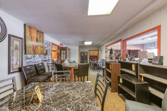 43125 Rd 80, Dinuba, CA 93618 - dining area with carpet and a textured ceiling