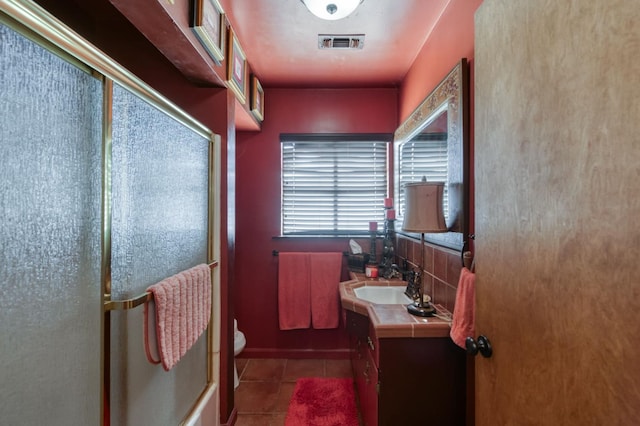 43125 Rd 80, Dinuba, CA 93618 - full bath with vanity, an enclosed shower, and tile patterned floors