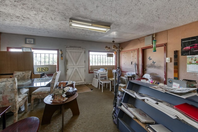 43125 Rd 80, Dinuba, CA 93618 - living area with a textured ceiling, plenty of natural light, carpet floors, and a chandelier