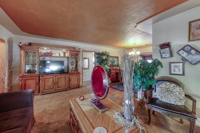 43125 Rd 80, Dinuba, CA 93618 - living area with a textured ceiling, a chandelier, and light carpet